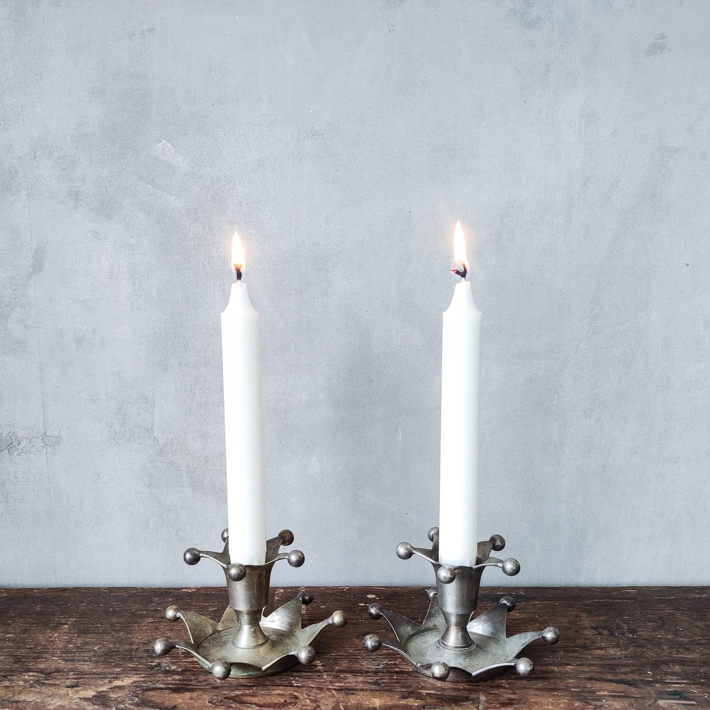 Pair of 1990s whimsical crown jester chrome candle holders
