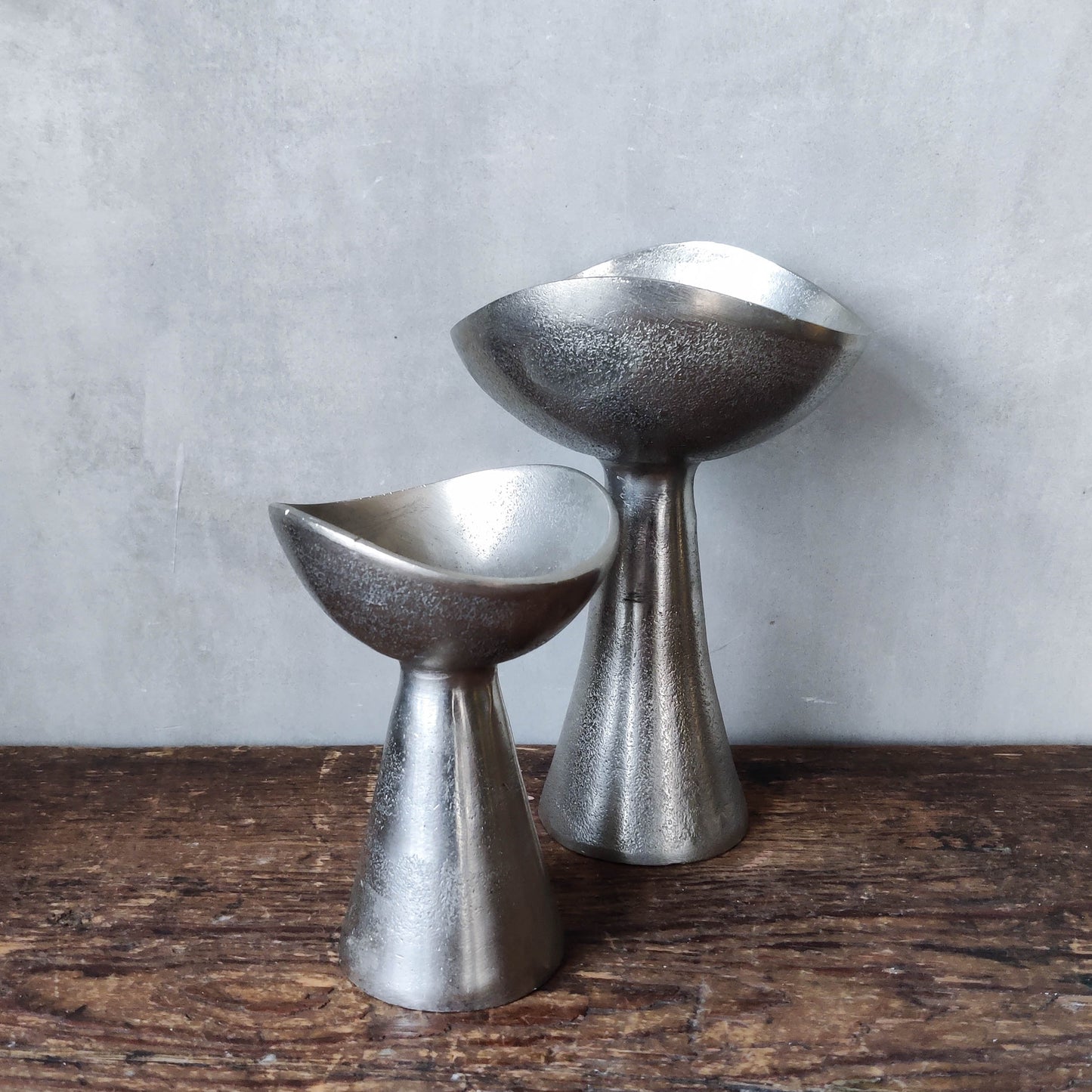 Pair of cast aluminium footed sculptural bowls