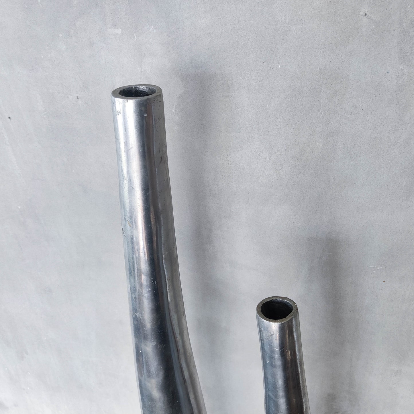 Vintage pair 90s modernist hand cast aluminium tapered organic form tall vases