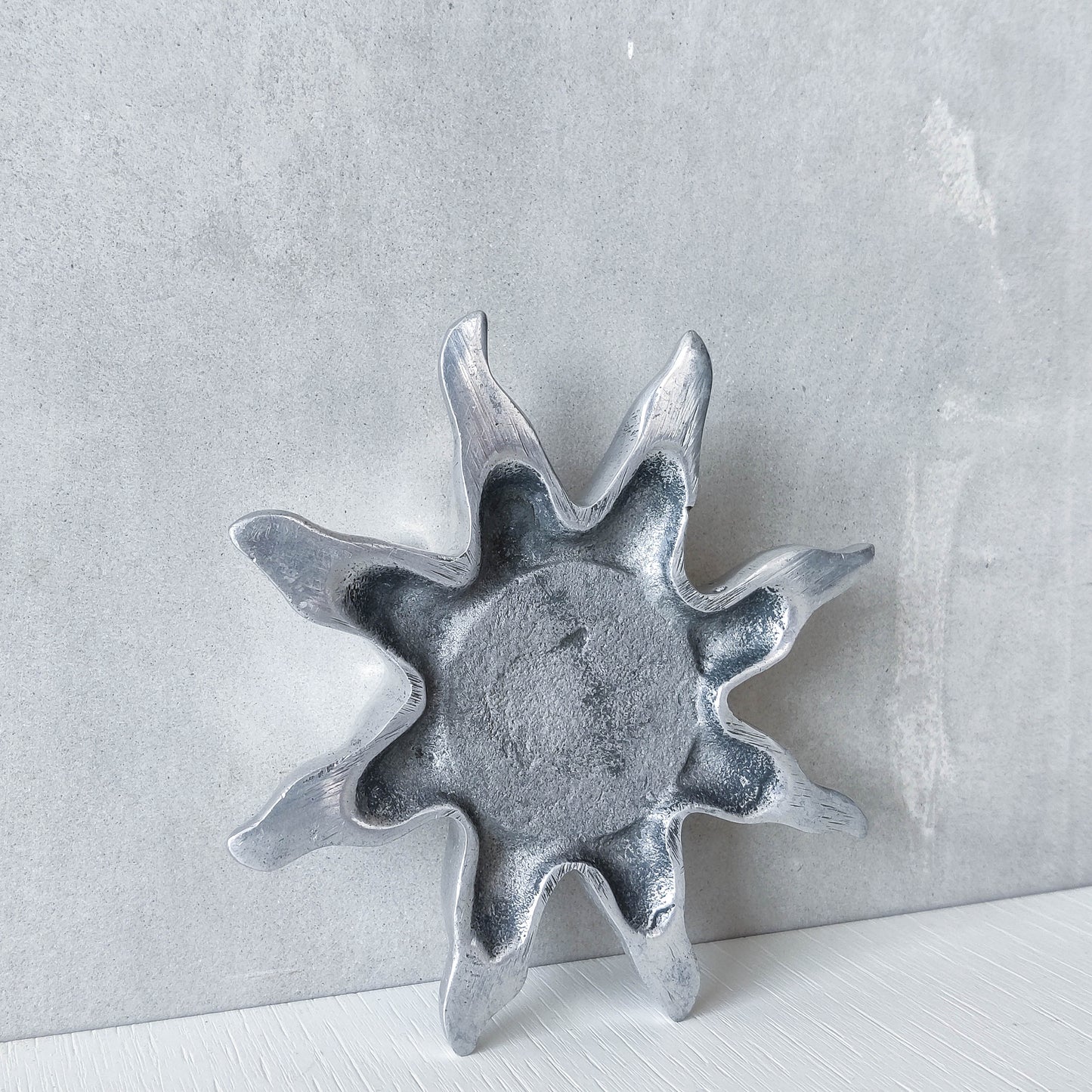 Vintage hand cast aluminium sculptural sun celestial tea light holder