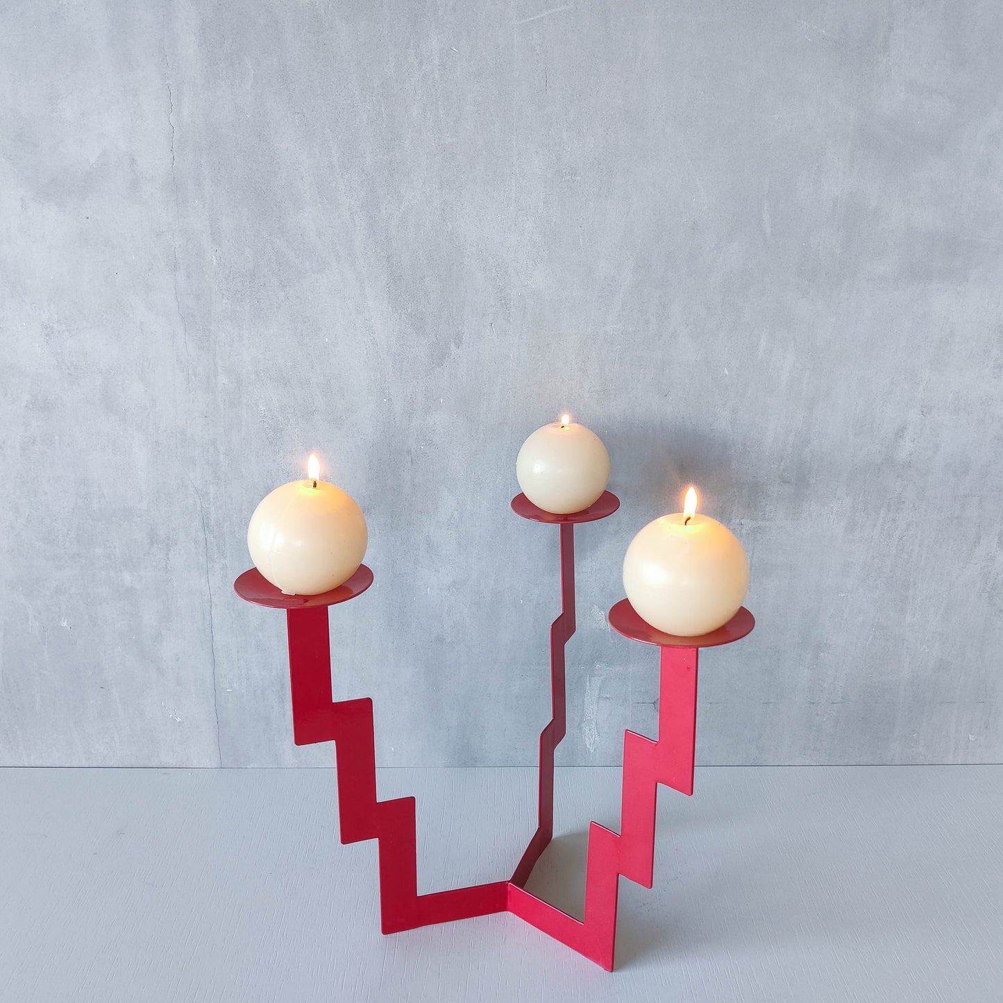 Vintage postmodern style large red steel zigzag candelabra