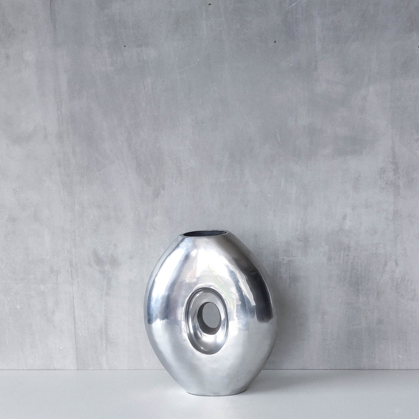 Vintage large sculptural modernist hand cast aluminium oval donut vase