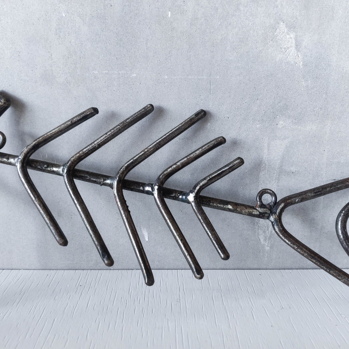 Vintage artisan made metalwork welded steel fish skeleton toilet roll holder