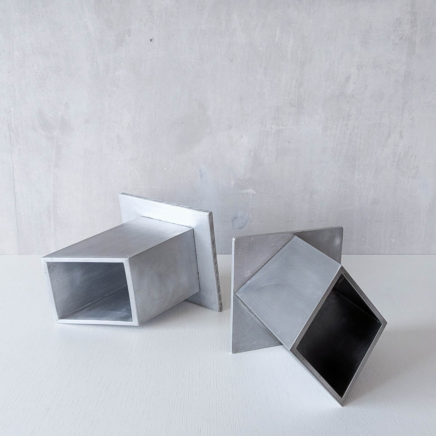 Pair of vintage scratch built sculptural aluminium desk tidy pen holders