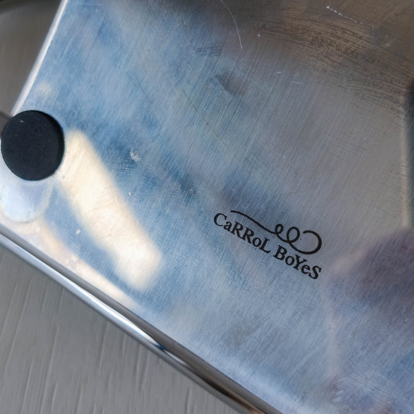 A Carrol Boyes sculpural figural cast metal book stand easel