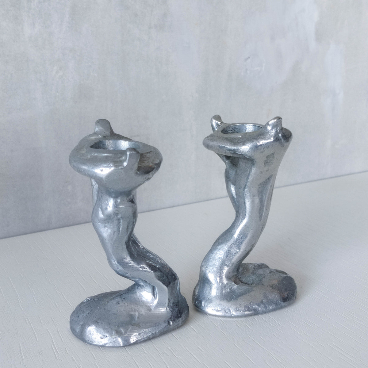 Pair of vintage 1980s ART3 David Marshall style cast aluminum brutalist candle holders