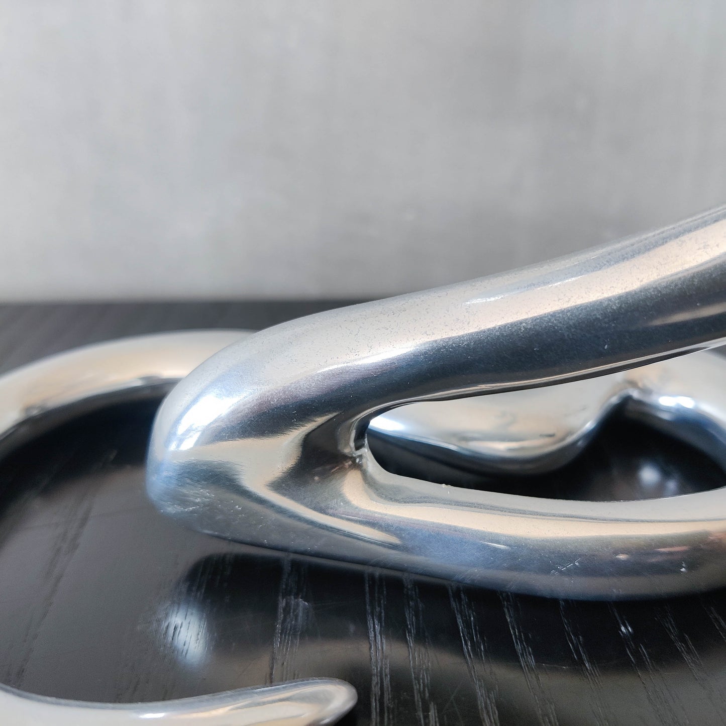 00s cast aluminium sculptural wavy candle holder