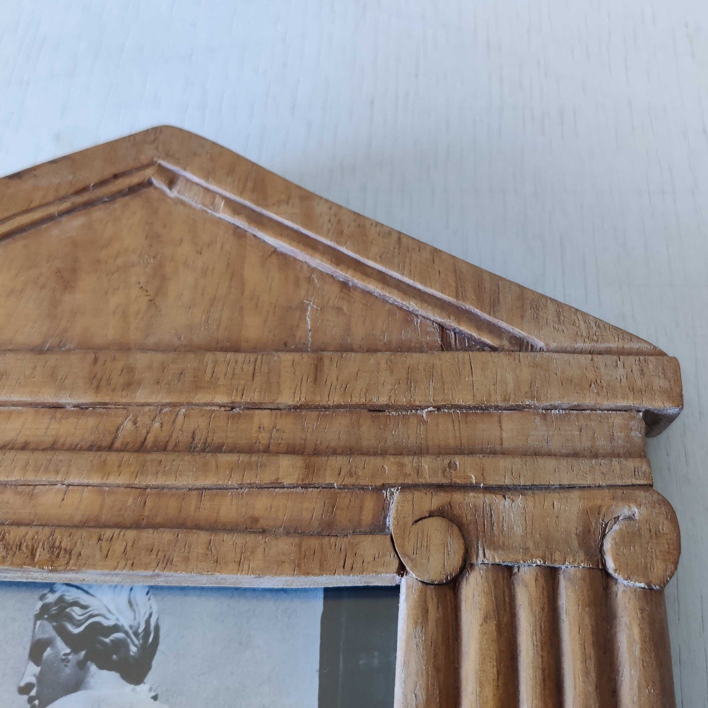 A hand carved hardwood neoclassical style photo frame