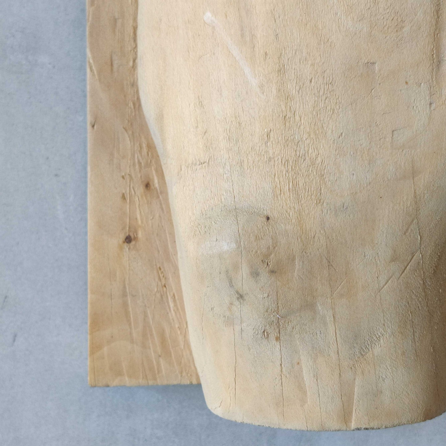 A carved tulip wood hand wall relief sculpture