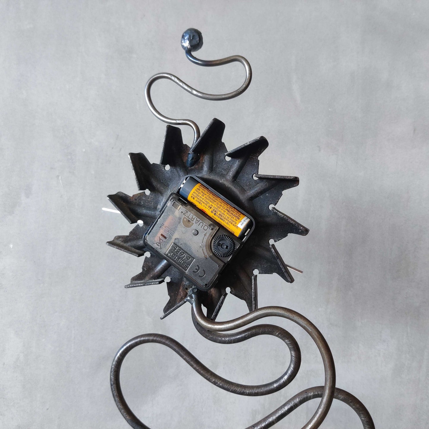 A large vintage blacksmith made forged steel abstract sculptural clock