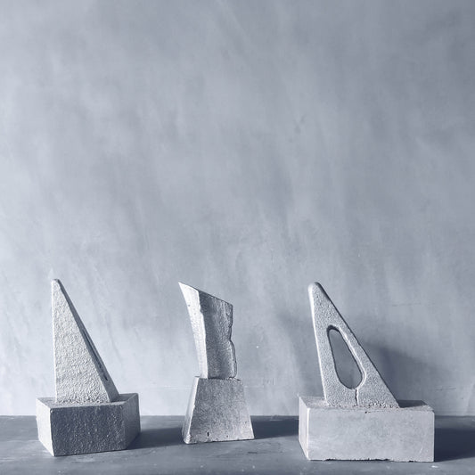 Trio of artist made abstract cast aluminium sculptures