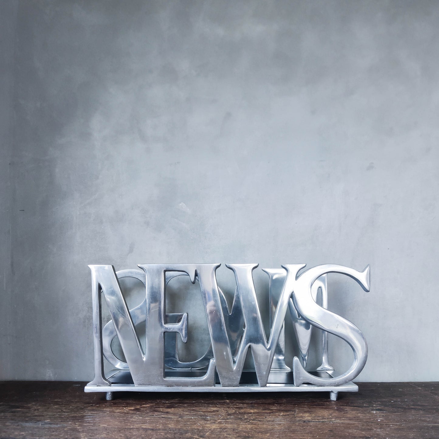 Vintage 00s cast aluminium metal magazine rack holder stand