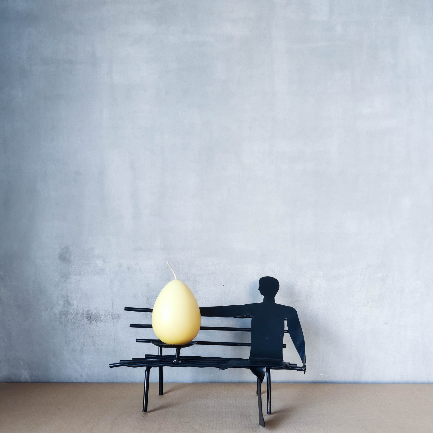 Surreal welded steel figure on bench candle holder 00s