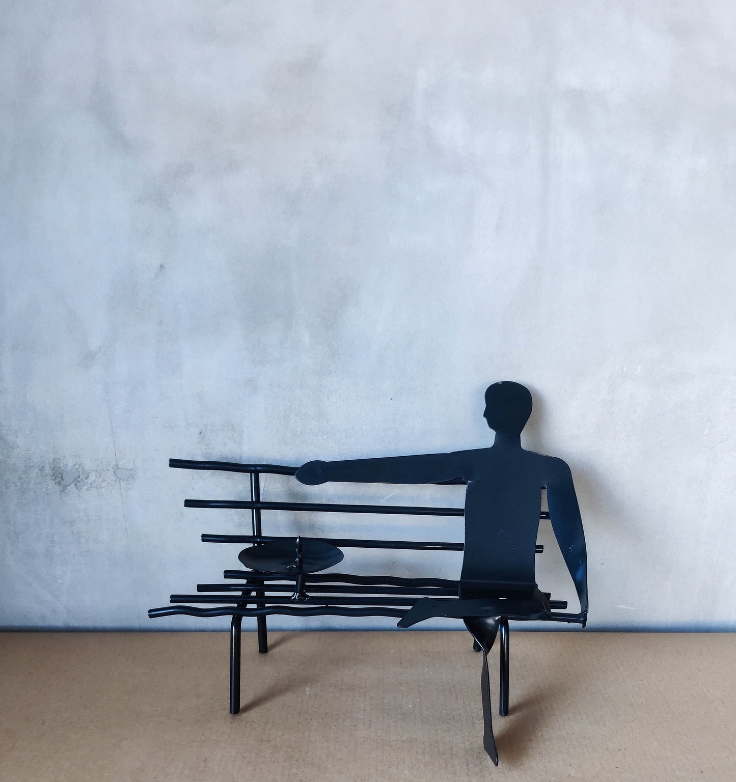 Surreal welded steel figure on bench candle holder 00s