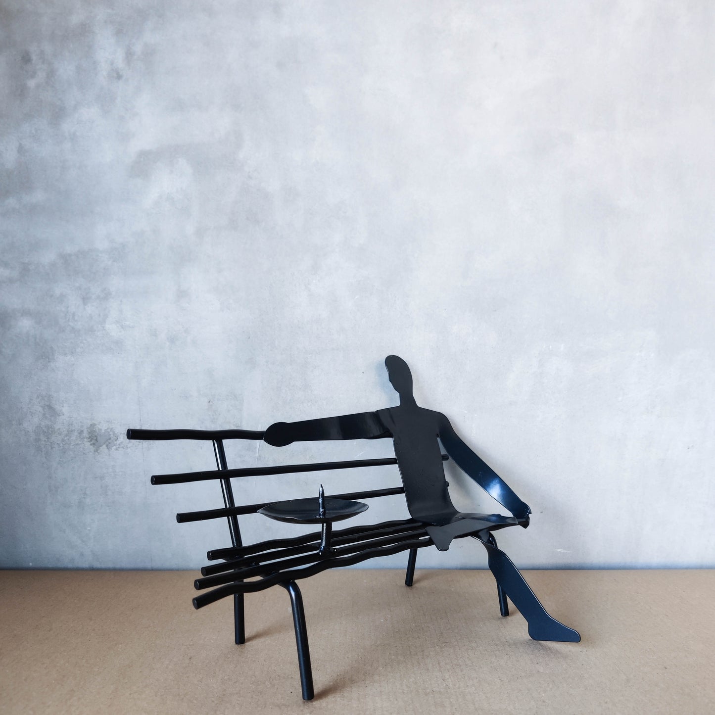 Surreal welded steel figure on bench candle holder 00s