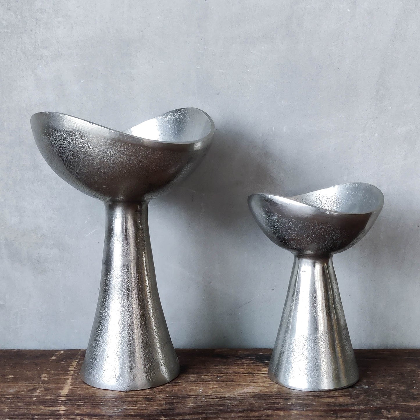 Pair of cast aluminium footed sculptural bowls
