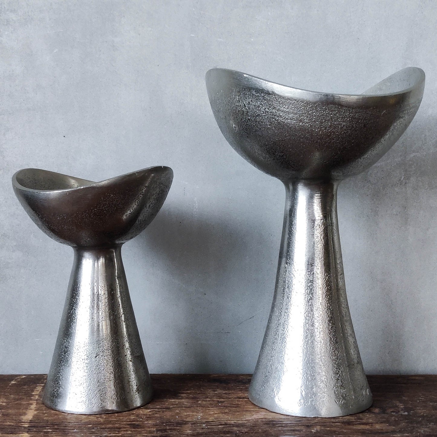 Pair of cast aluminium footed sculptural bowls