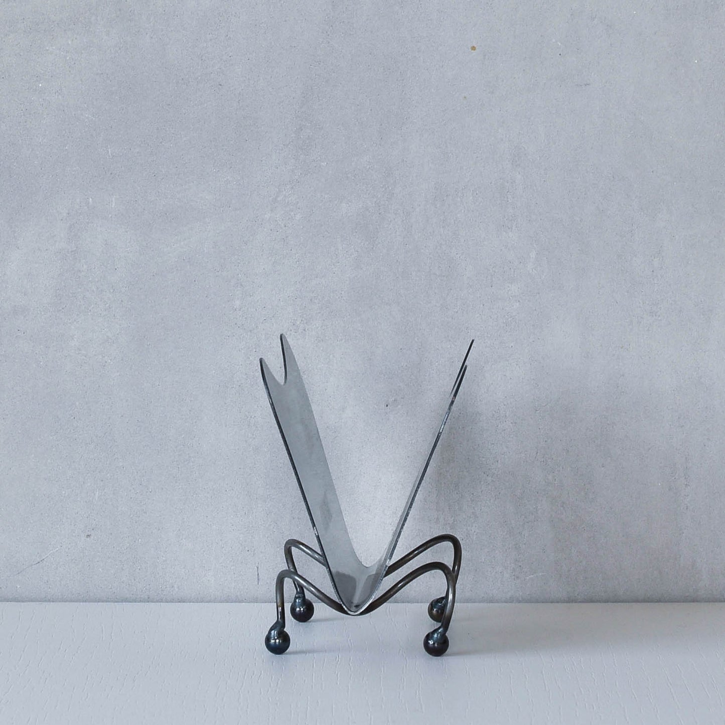 Vintage 1990s postmodern steel torch cut letter holder rack with spiral ball feet