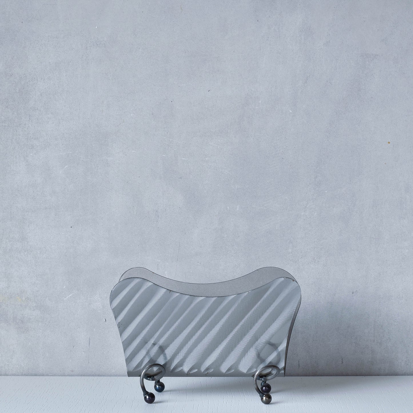 Vintage 1990s postmodern steel torch cut letter holder rack with spiral ball feet