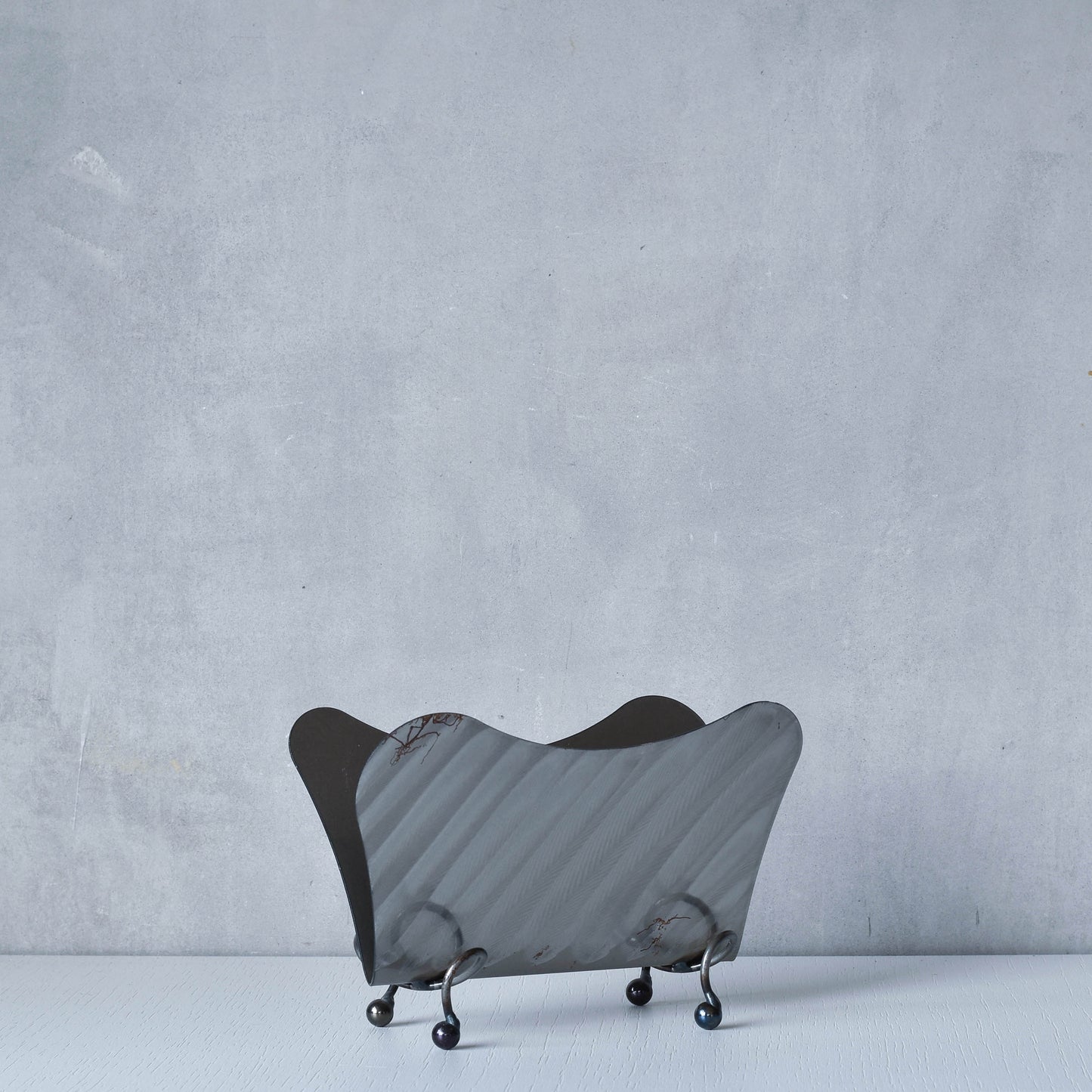 Vintage 1990s postmodern steel torch cut letter holder rack with spiral ball feet