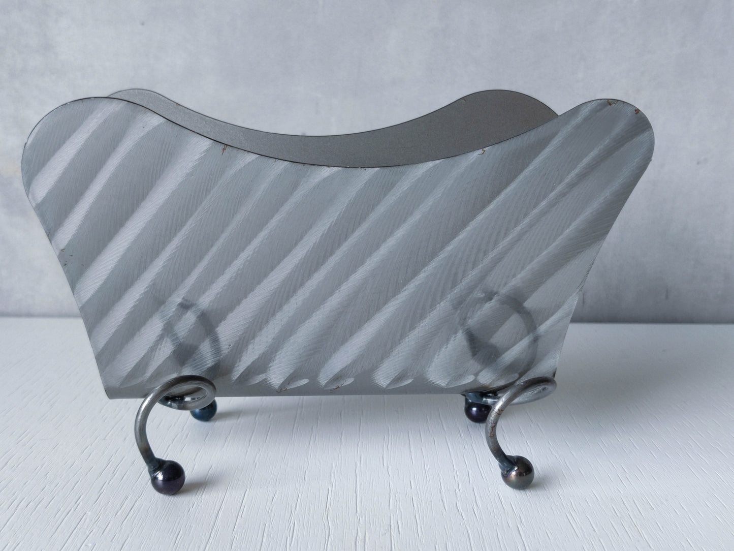 Vintage 1990s postmodern steel torch cut letter holder rack with spiral ball feet