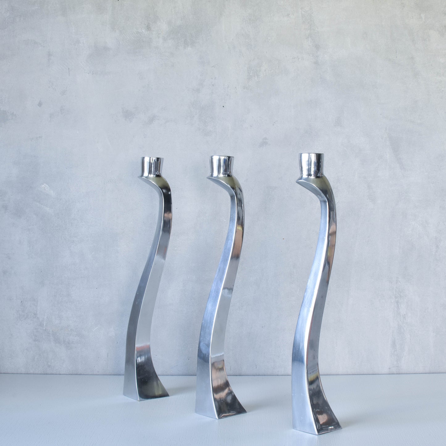 Trio of vintage aluminium Nessie Matthew Hilton style biomorphic candle holders