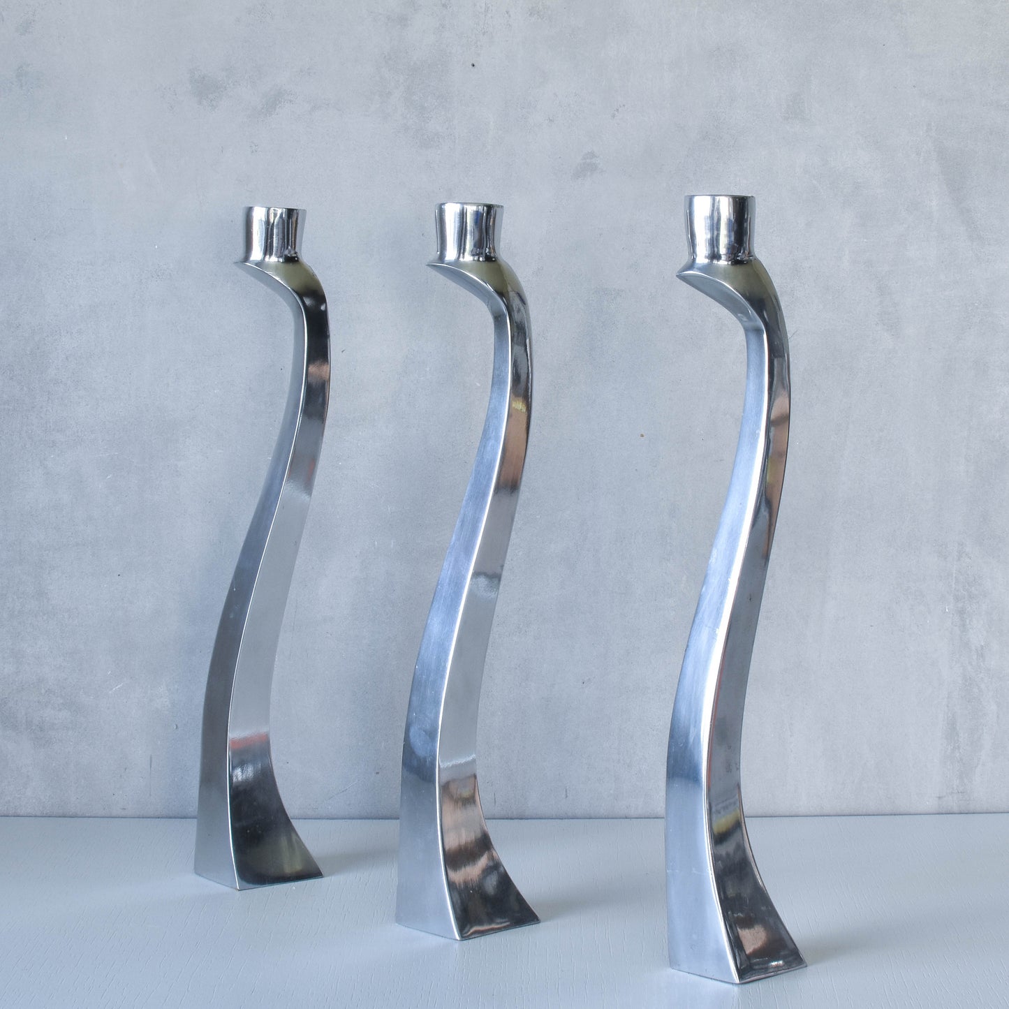 Trio of vintage aluminium Nessie Matthew Hilton style biomorphic candle holders