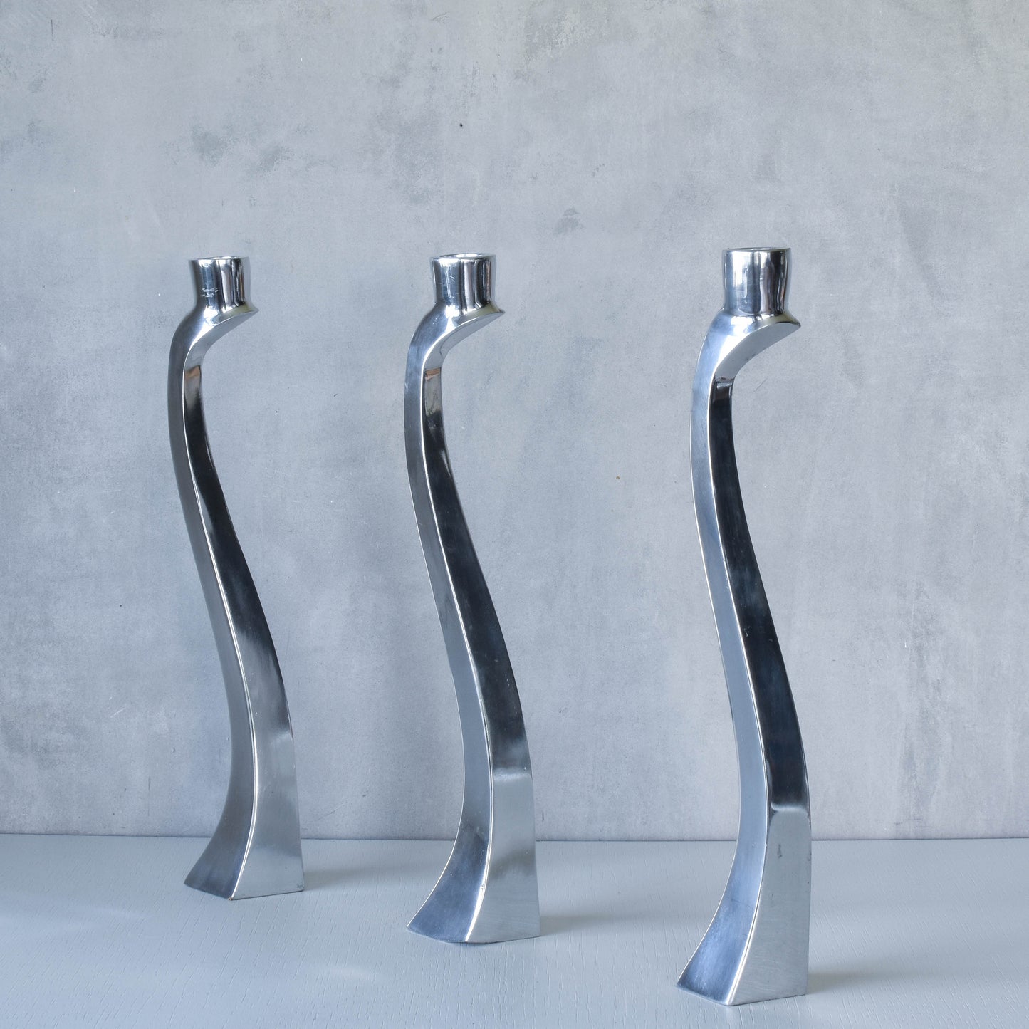 Trio of vintage aluminium Nessie Matthew Hilton style biomorphic candle holders