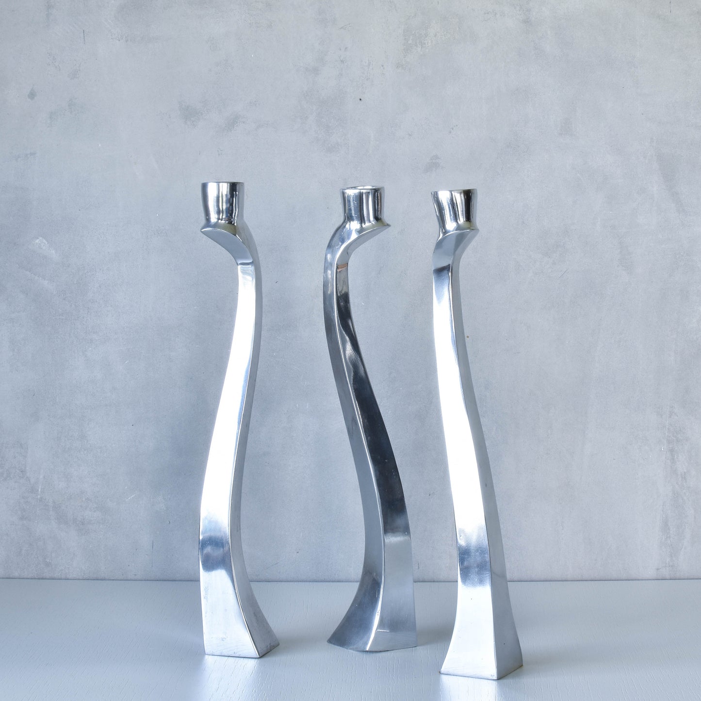 Trio of vintage aluminium Nessie Matthew Hilton style biomorphic candle holders