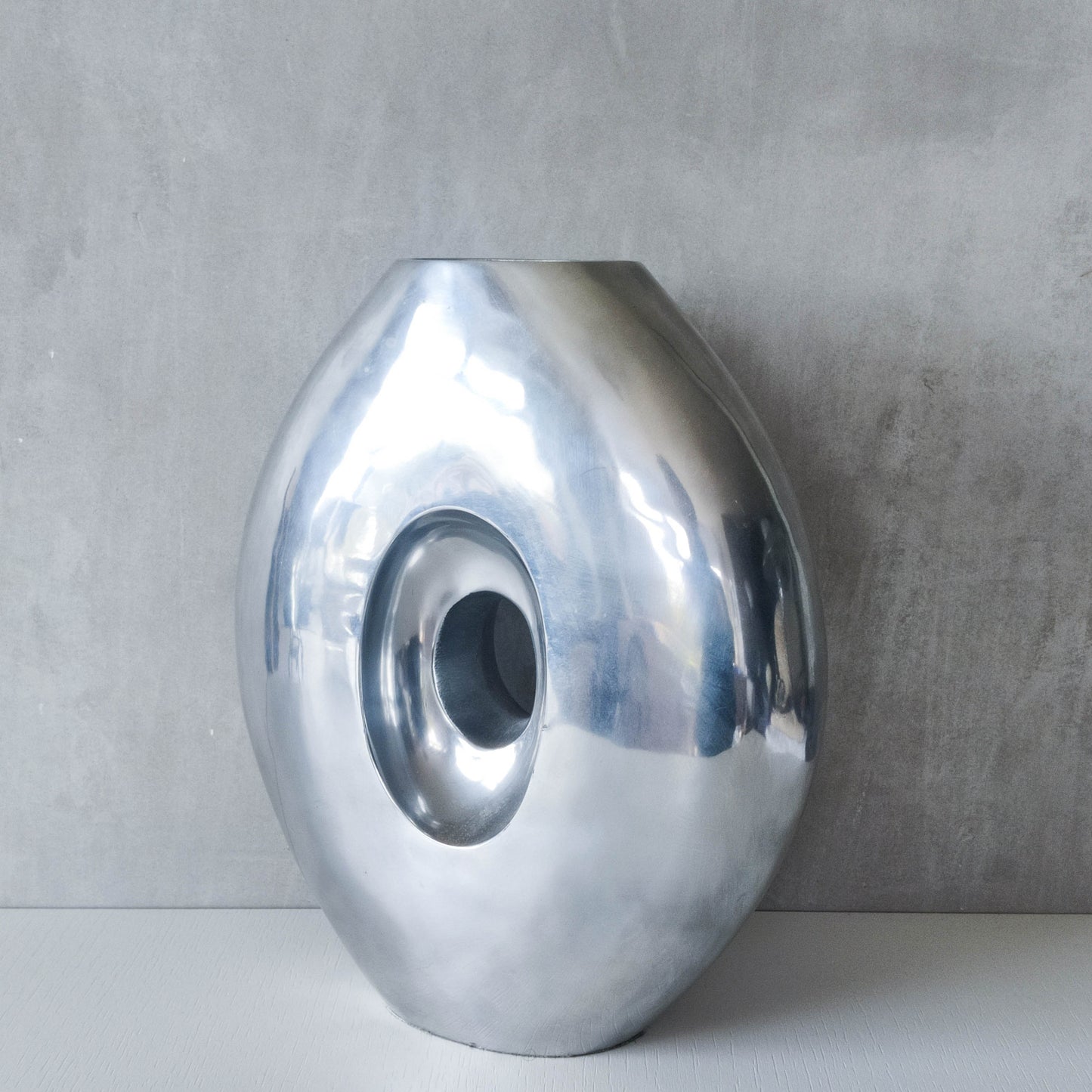 Vintage large sculptural modernist hand cast aluminium oval donut vase 32cm