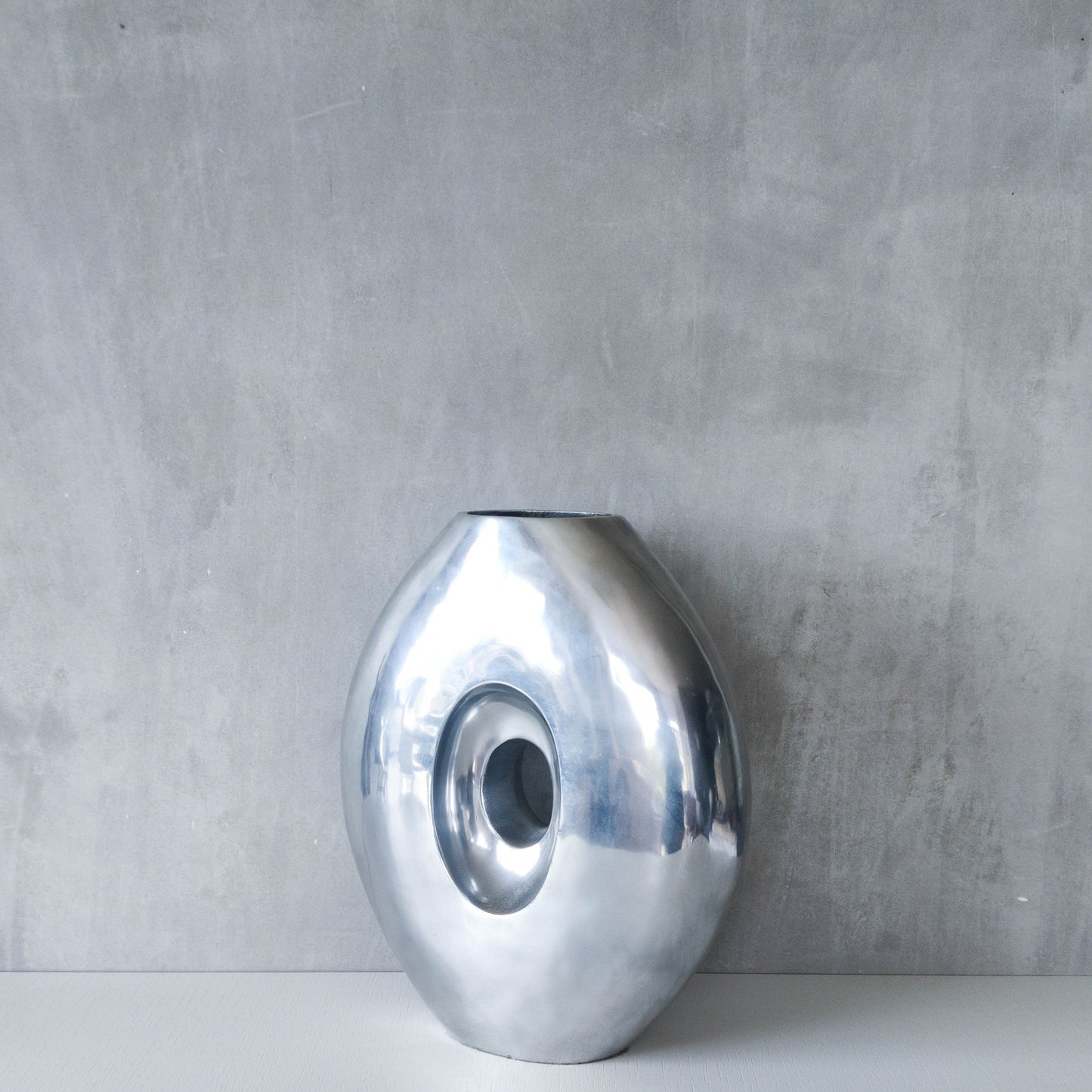 Vintage large sculptural modernist hand cast aluminium oval donut vase 32cm