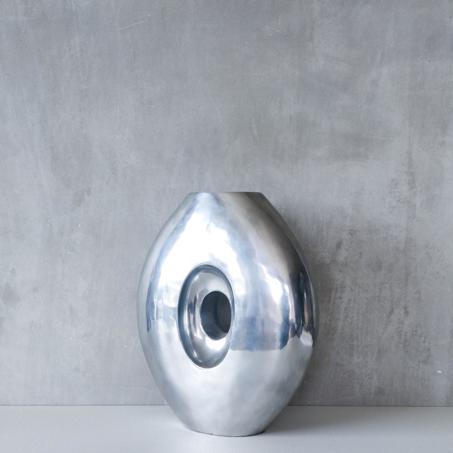 Vintage large sculptural modernist hand cast aluminium oval donut vase 32cm