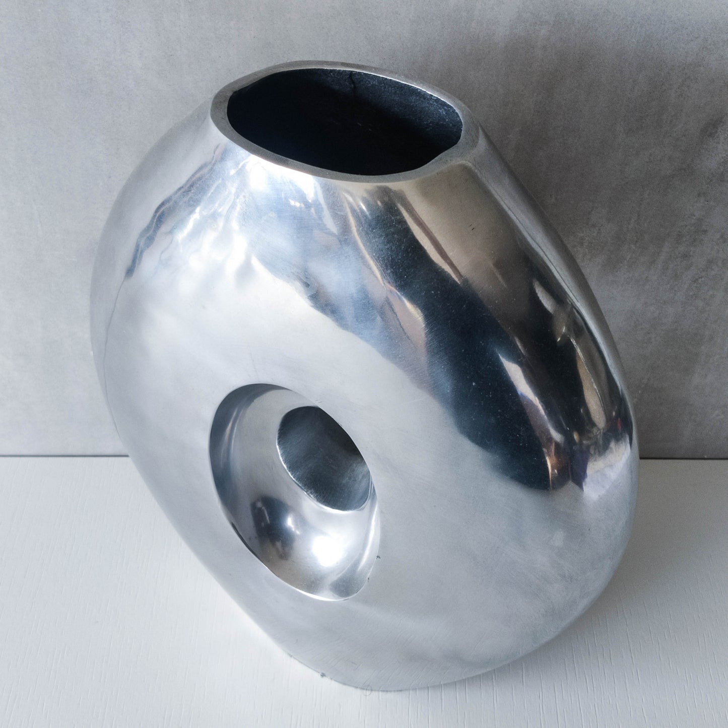 Vintage large sculptural modernist hand cast aluminium oval donut vase 32cm
