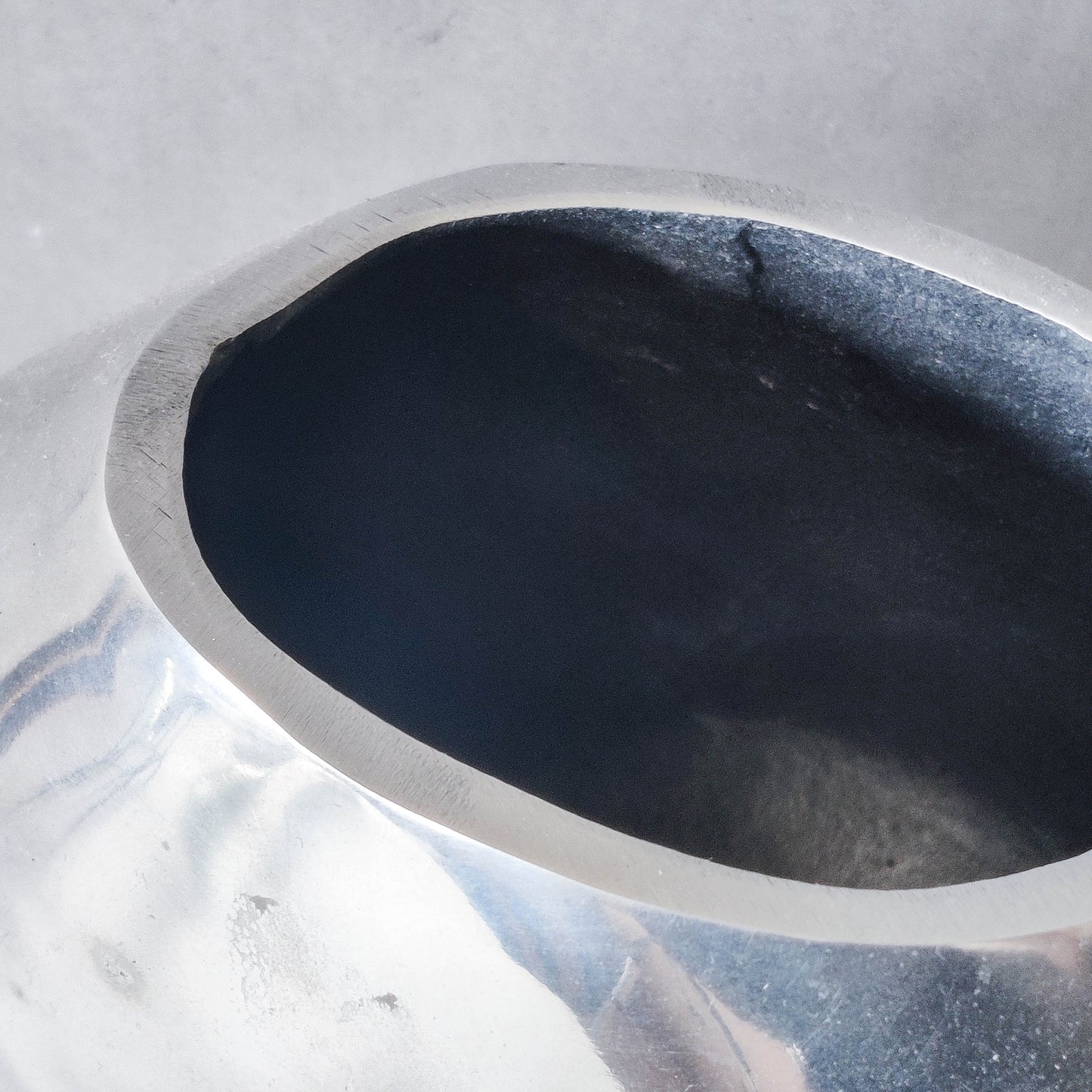 Vintage large sculptural modernist hand cast aluminium oval donut vase 32cm