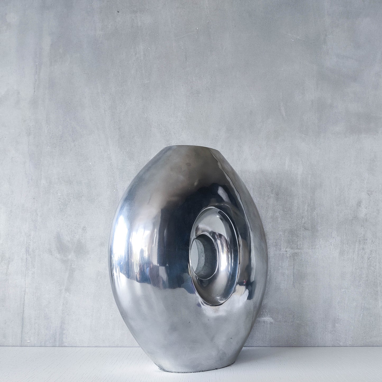 Vintage large sculptural modernist hand cast aluminium oval donut vase 32cm