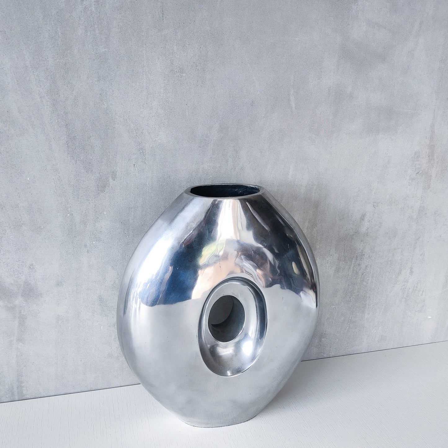 Vintage large sculptural modernist hand cast aluminium oval donut vase 32cm