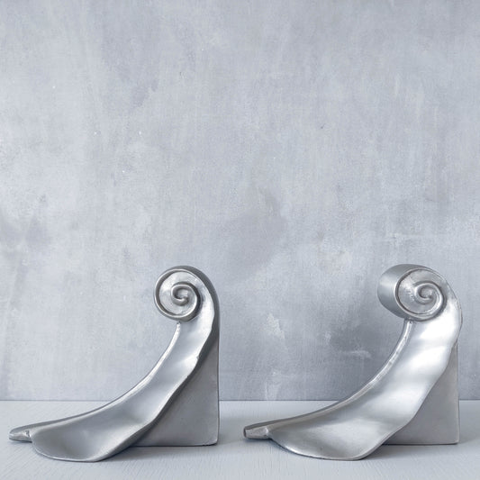 Vintage 00s cast aluminium swirl spiral scroll weighted sculpture bookends pair