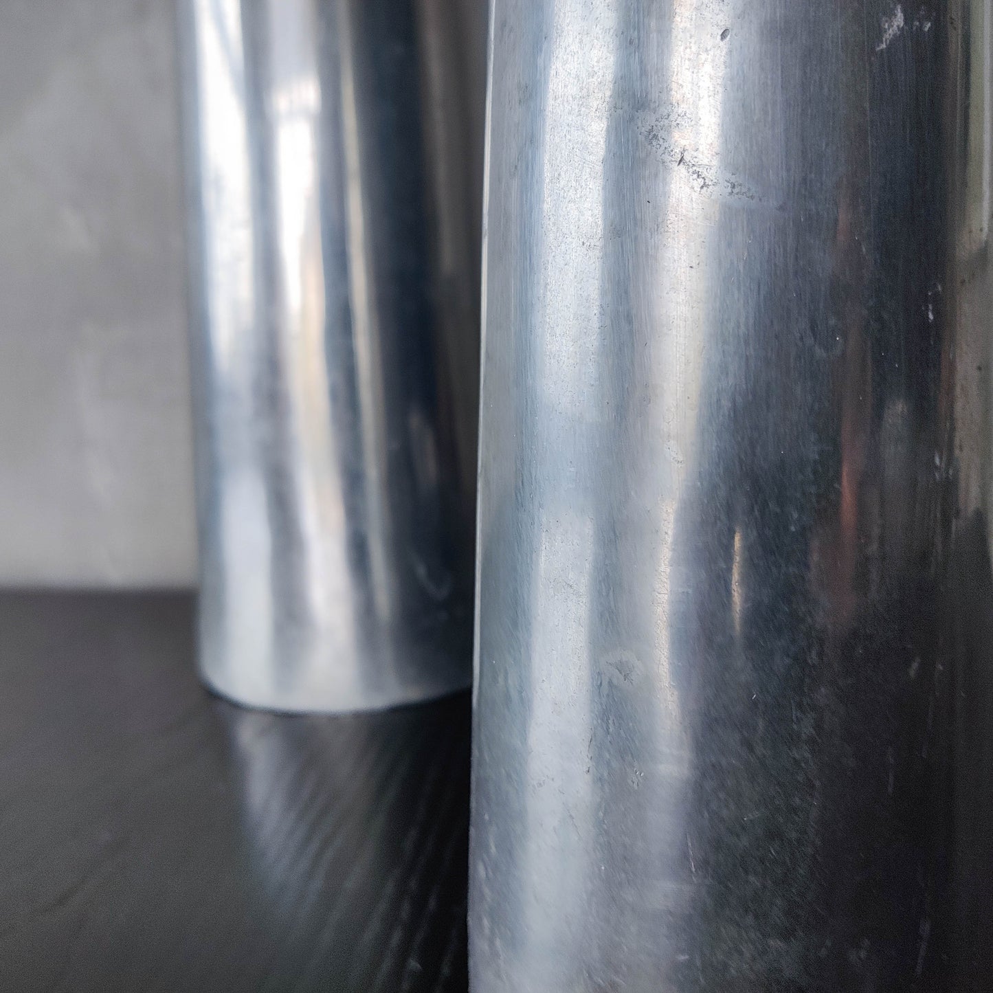 Vintage pair 90s modernist hand cast aluminium tapered organic form tall vases