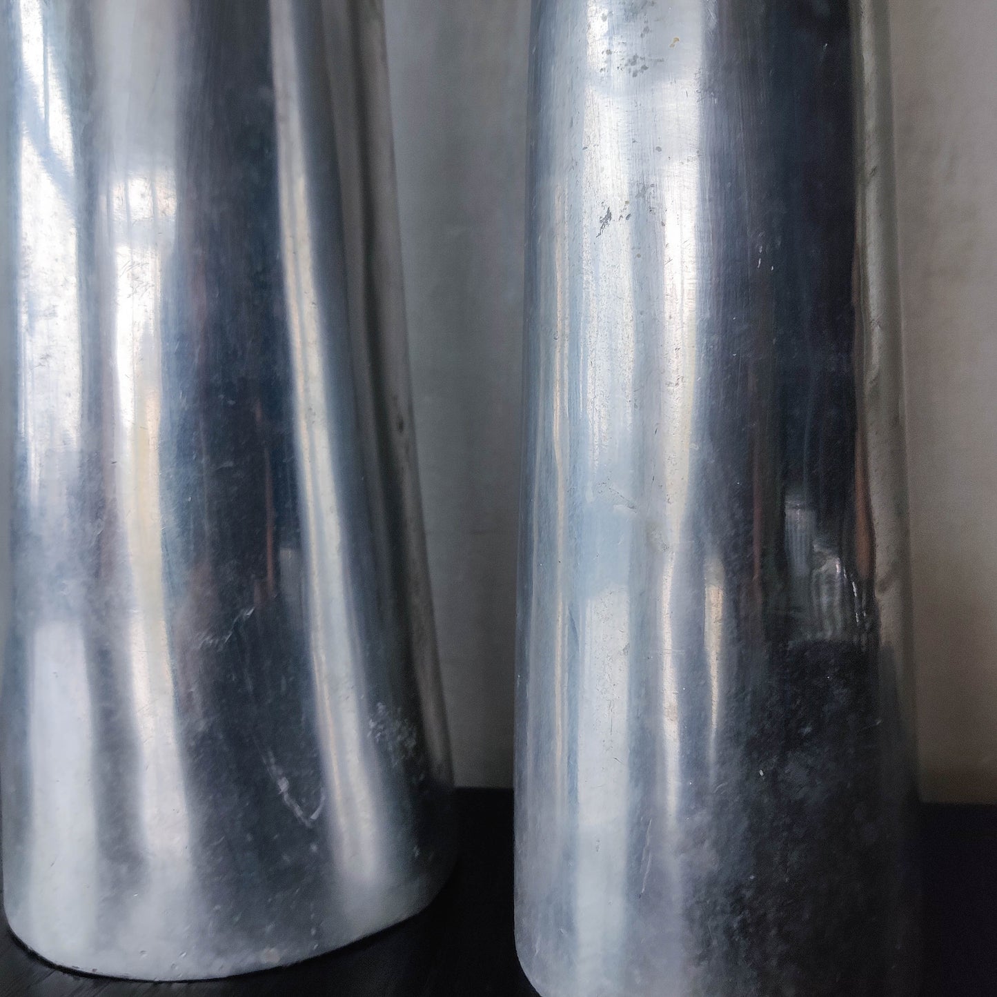 Vintage pair 90s modernist hand cast aluminium tapered organic form tall vases