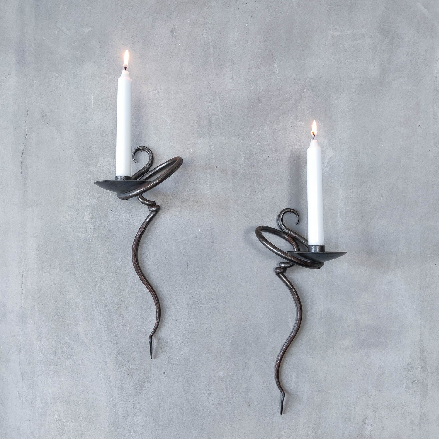 Pair of vintage hand forged blacksmith made hammered twisted steel candle sconces
