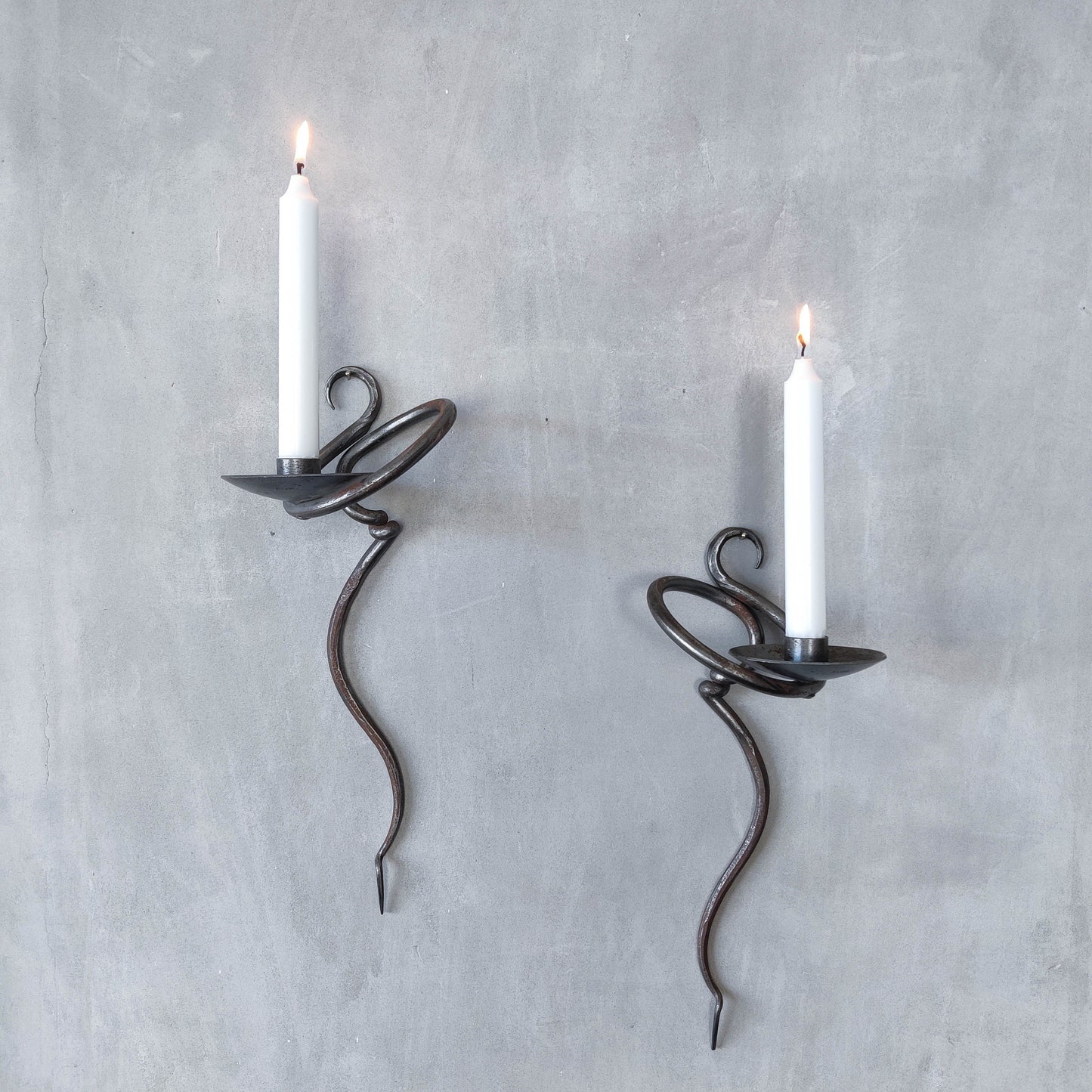 Pair of vintage hand forged blacksmith made hammered twisted steel candle sconces