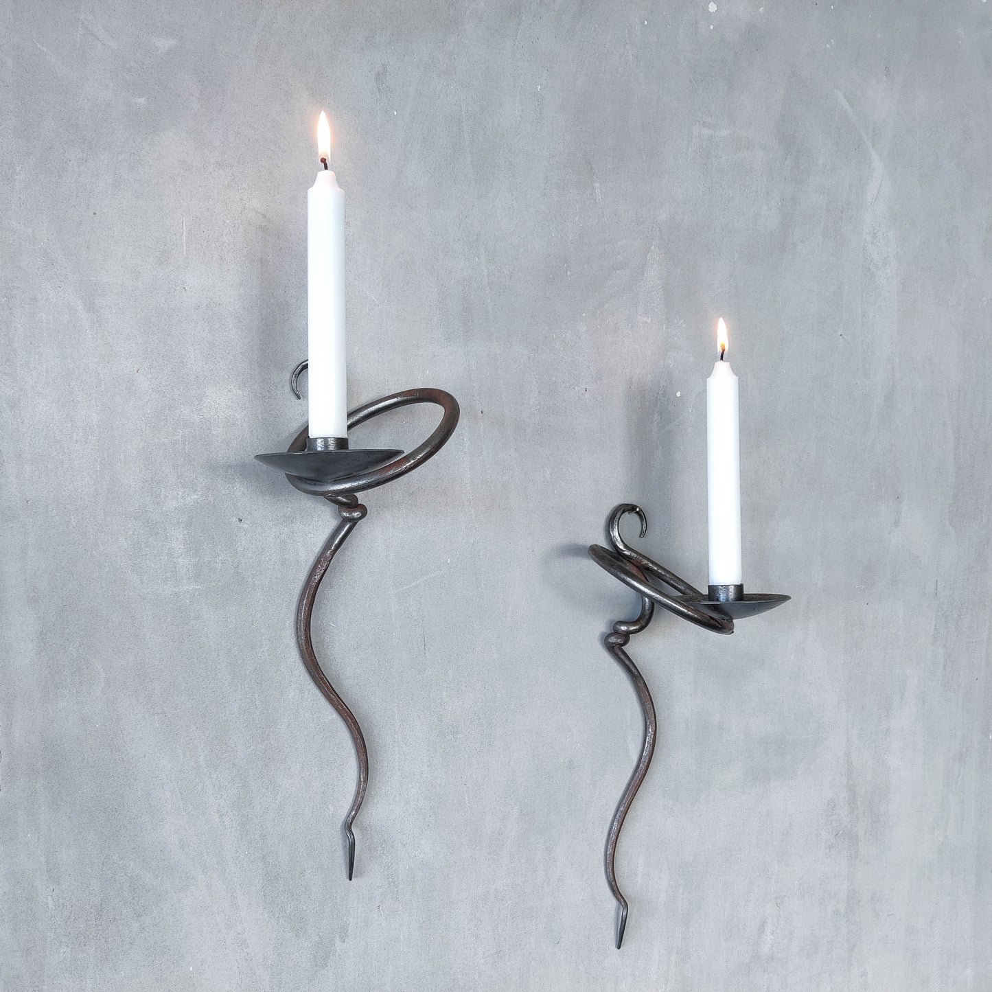 Pair of vintage hand forged blacksmith made hammered twisted steel candle sconces