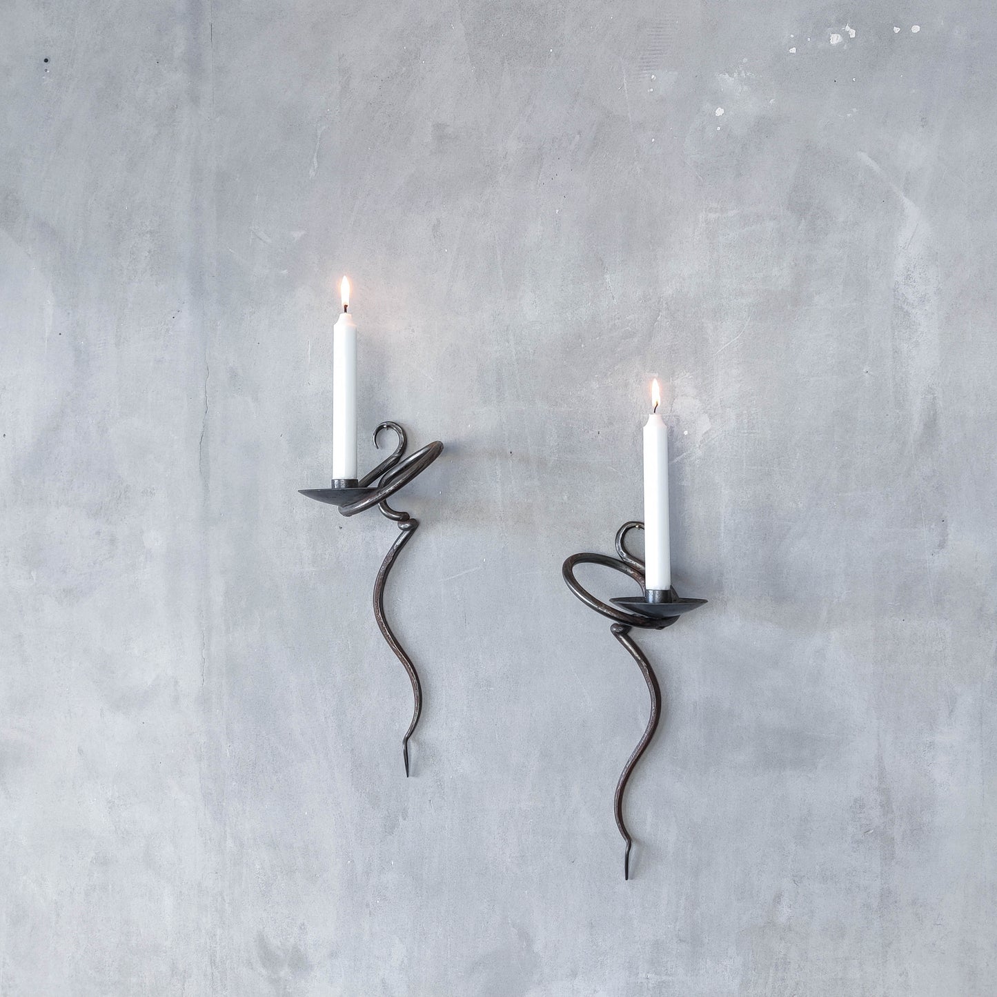 Pair of vintage hand forged blacksmith made hammered twisted steel candle sconces