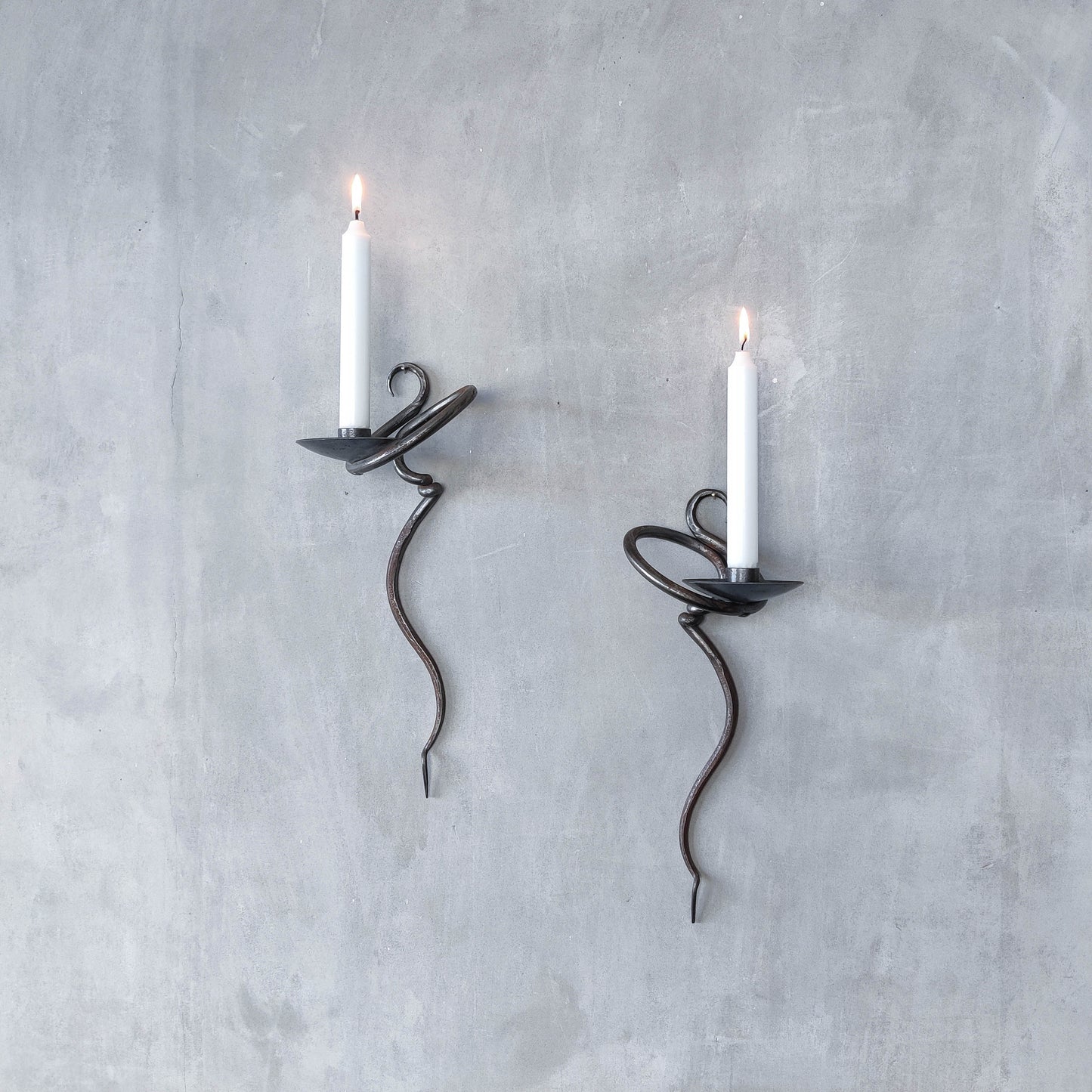 Pair of vintage hand forged blacksmith made hammered twisted steel candle sconces