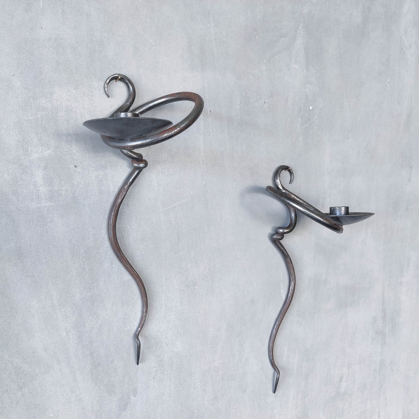 Pair of vintage hand forged blacksmith made hammered twisted steel candle sconces