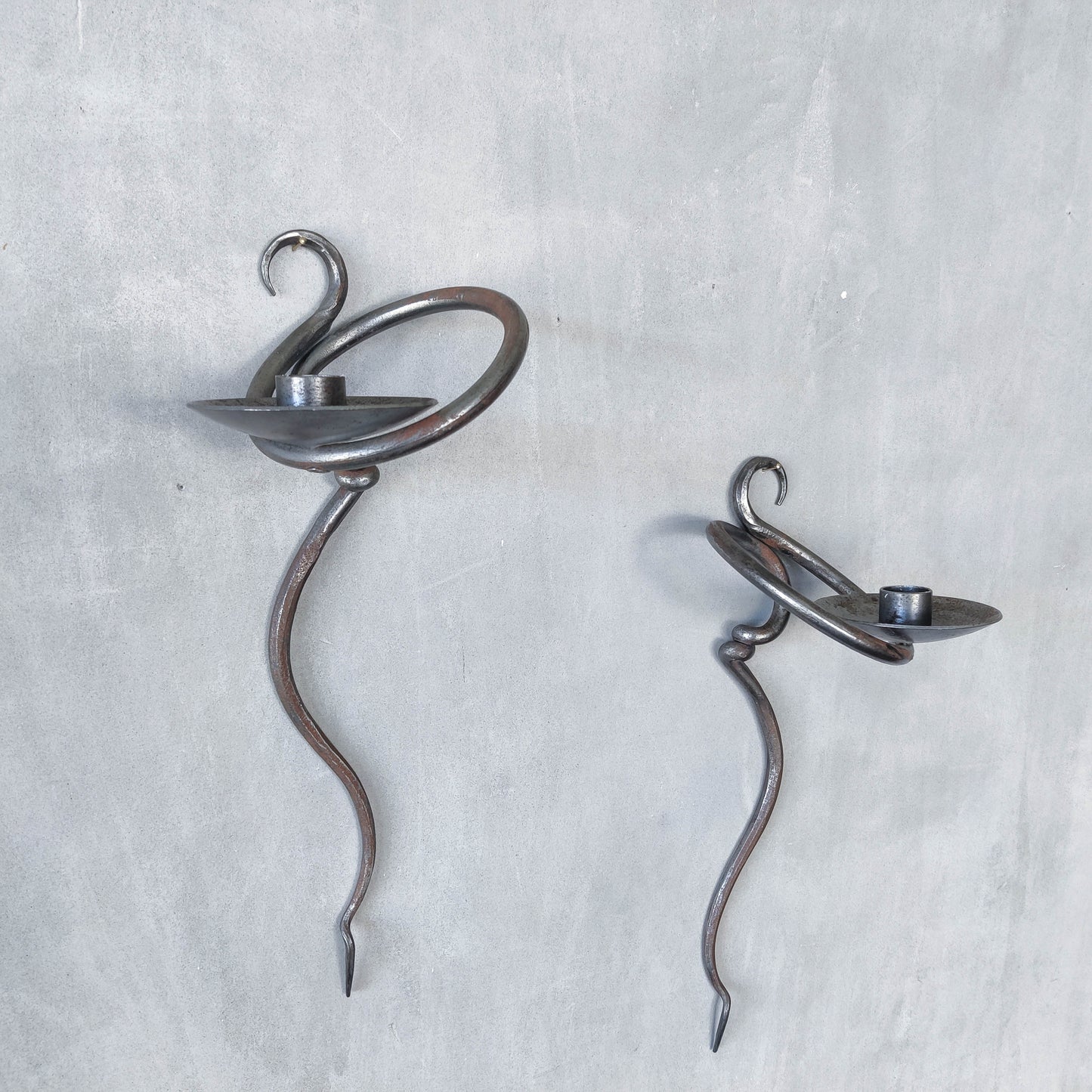 Pair of vintage hand forged blacksmith made hammered twisted steel candle sconces