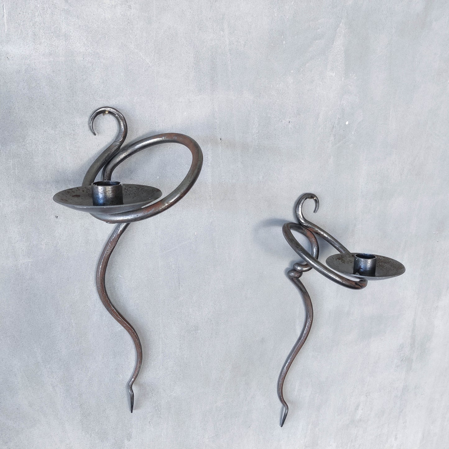 Pair of vintage hand forged blacksmith made hammered twisted steel candle sconces
