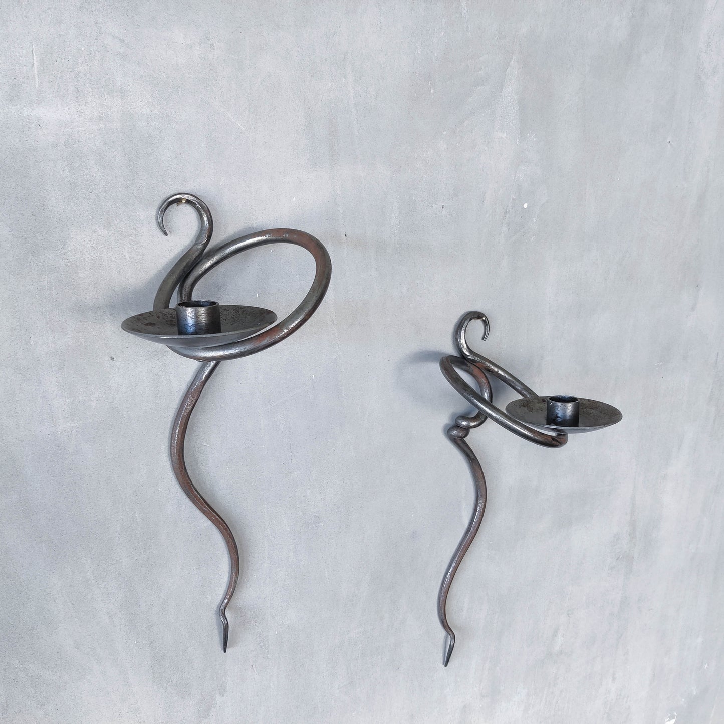 Pair of vintage hand forged blacksmith made hammered twisted steel candle sconces