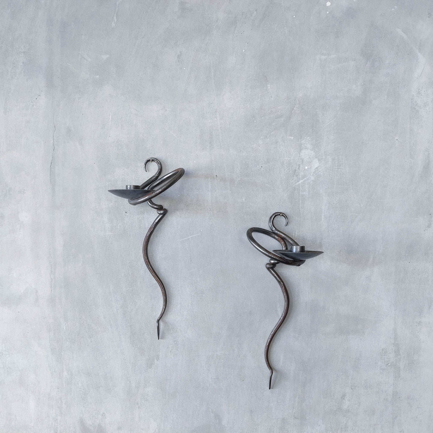 Pair of vintage hand forged blacksmith made hammered twisted steel candle sconces