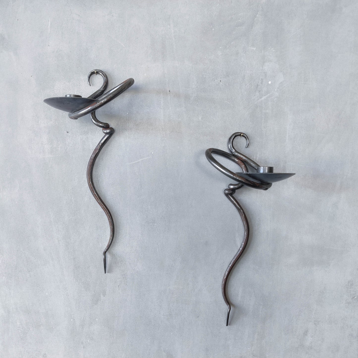 Pair of vintage hand forged blacksmith made hammered twisted steel candle sconces